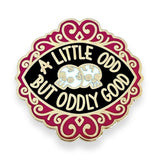 Pin with 'A Little Odd But Oddly Good' text and skull design on a white background