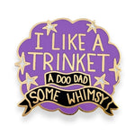 Purple and gold enamel pin with I like a trinket, a doo-dad, some whimsy design on a cloud background