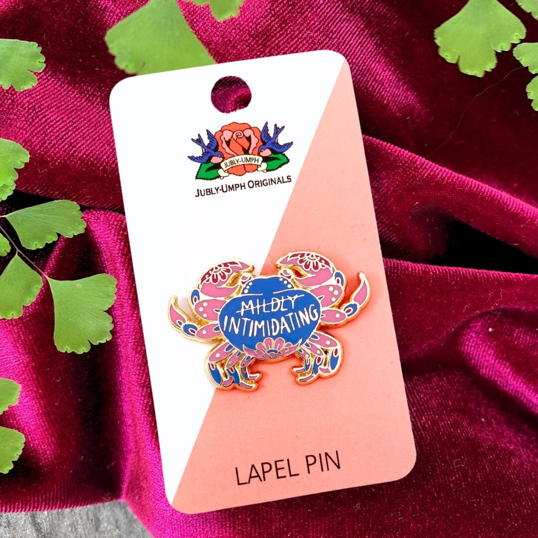 mildly intimidating pin on backing card with plant and velvet red background