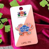 mildly intimidating pin on backing card with plant and velvet red background