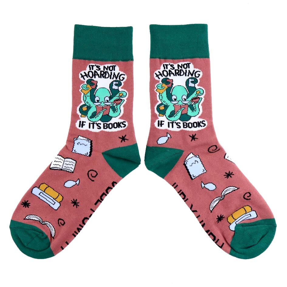 A pair of socks standing against a white background. The socks are green and light brown with a light green octopus. The socks read It's Not Hoarding If It's Books.