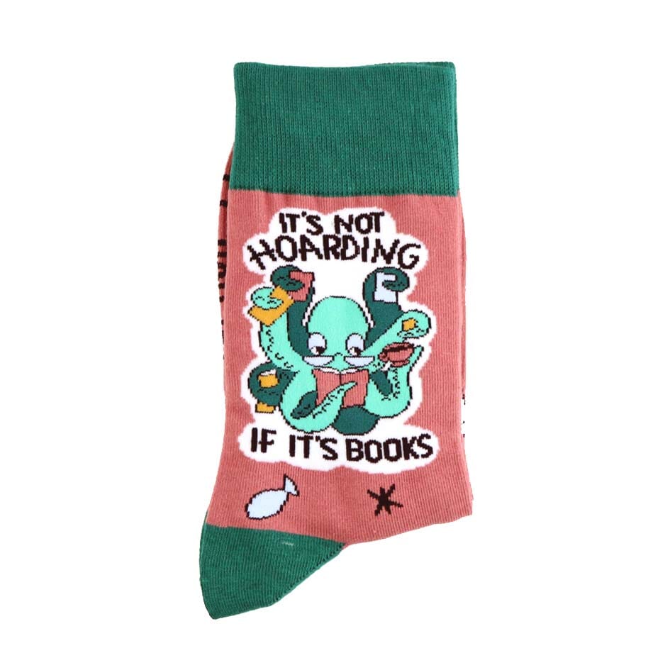 A pair of socks standing against a white background. The socks are green and light brown with a light green octopus. The socks read It's Not Hoarding If It's Books.