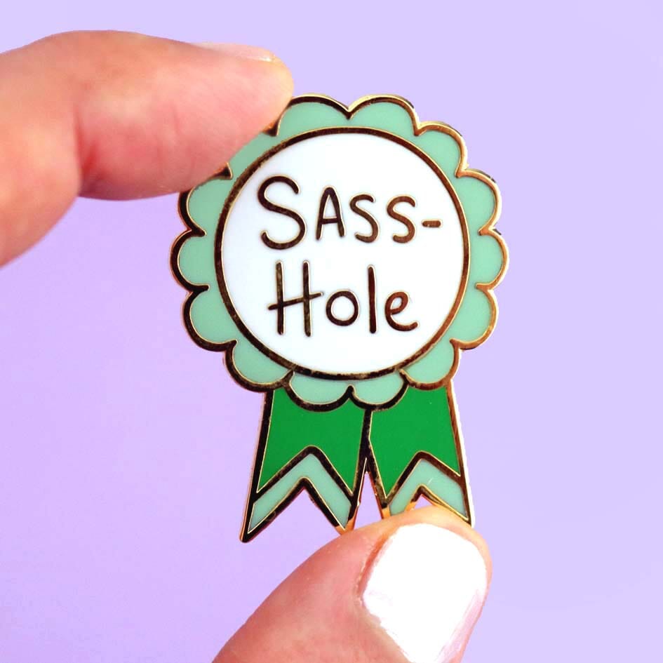 Sass-Hole Lapel Pin held with fingers