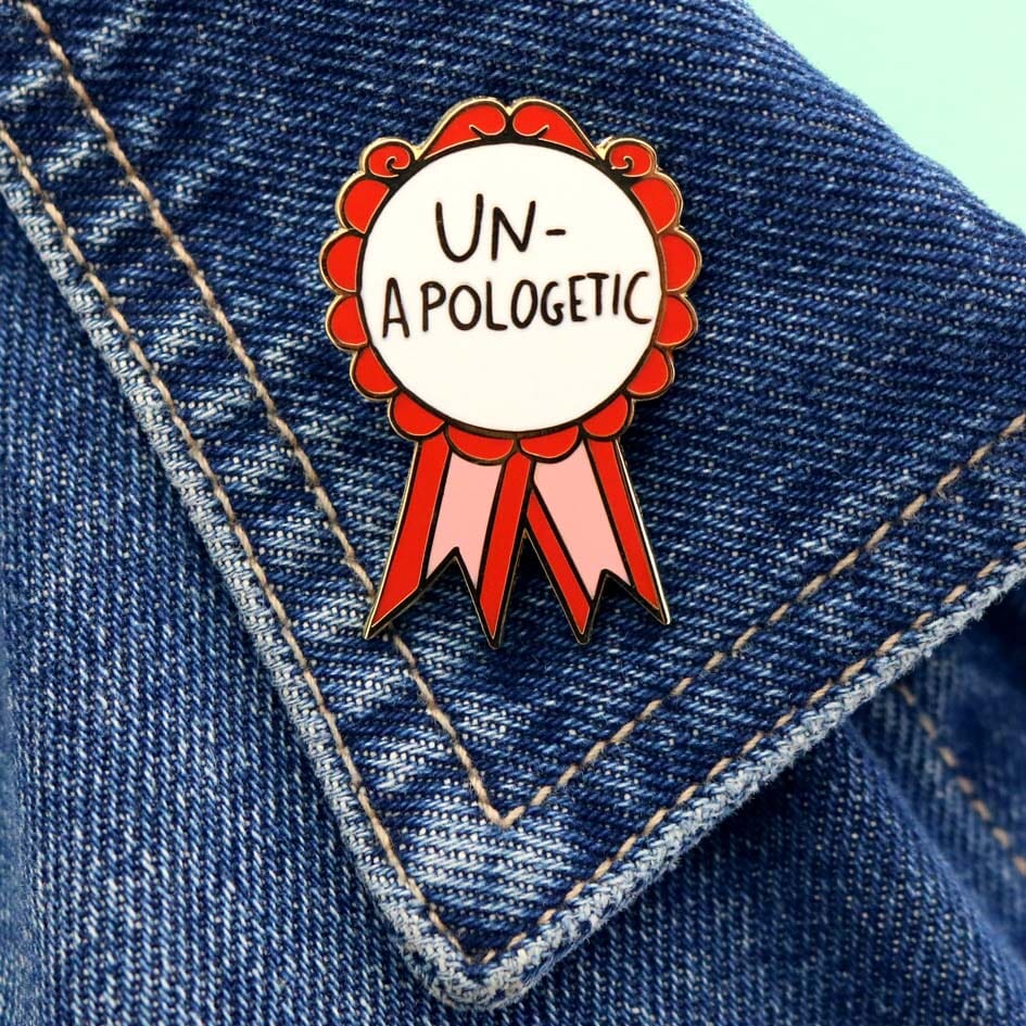 Un-Apologetic Lapel Pin on a demin jacket lapel