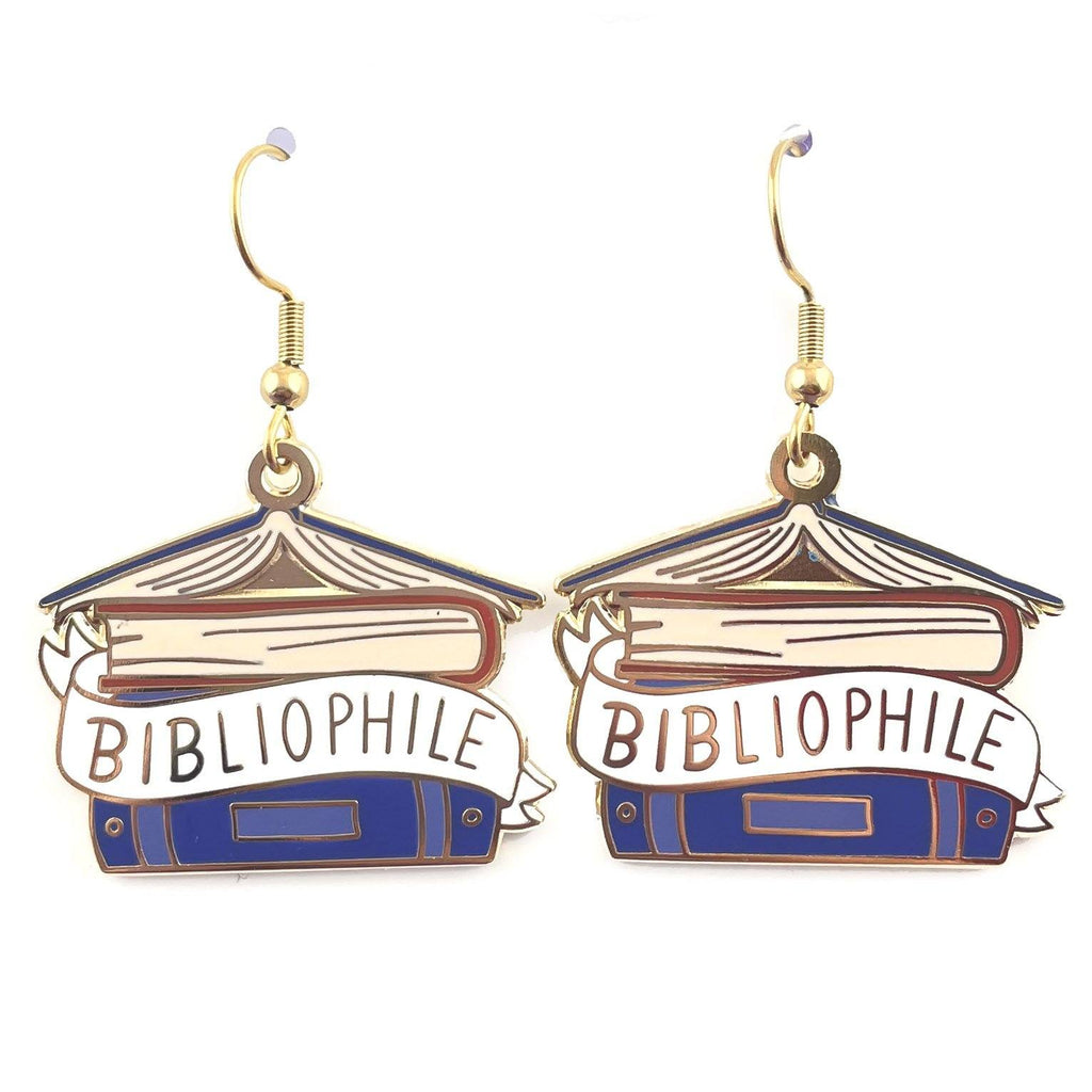 A pair of dangle earrings displayed on a white background. The earrings say Bibliophile in the middle of a stack of blue books.